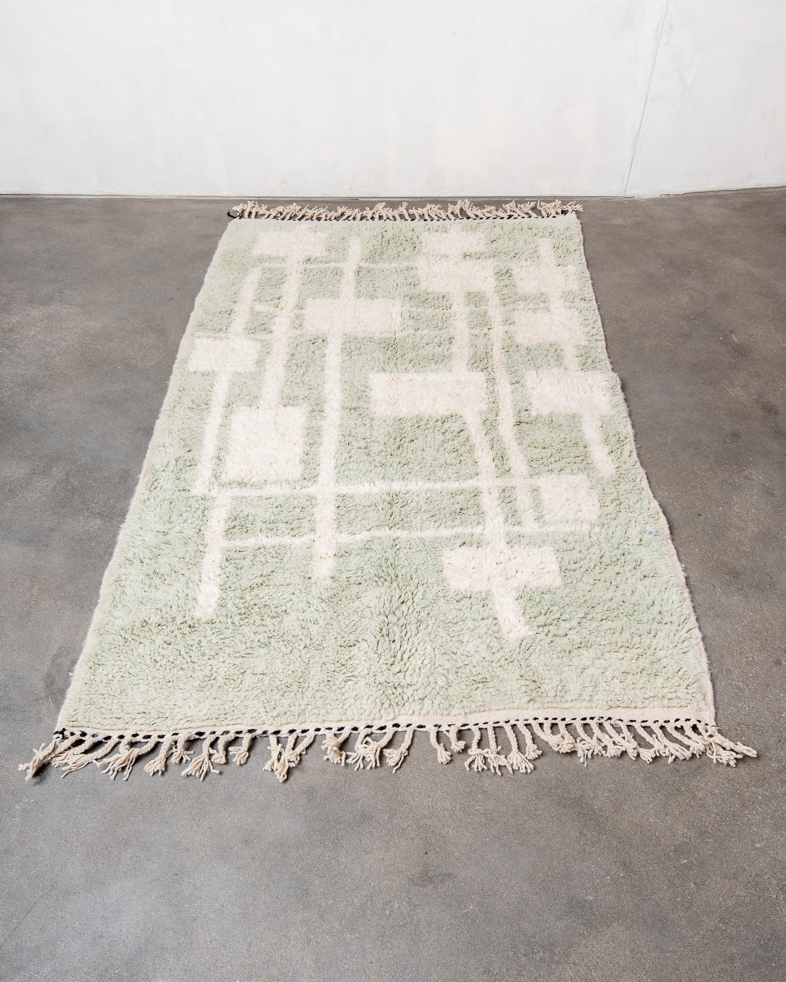 Modern, designer, handcrafted Berber rug from Morocco. Beniourain carpet with beautiful colours and patterns and fluffy wool texture.